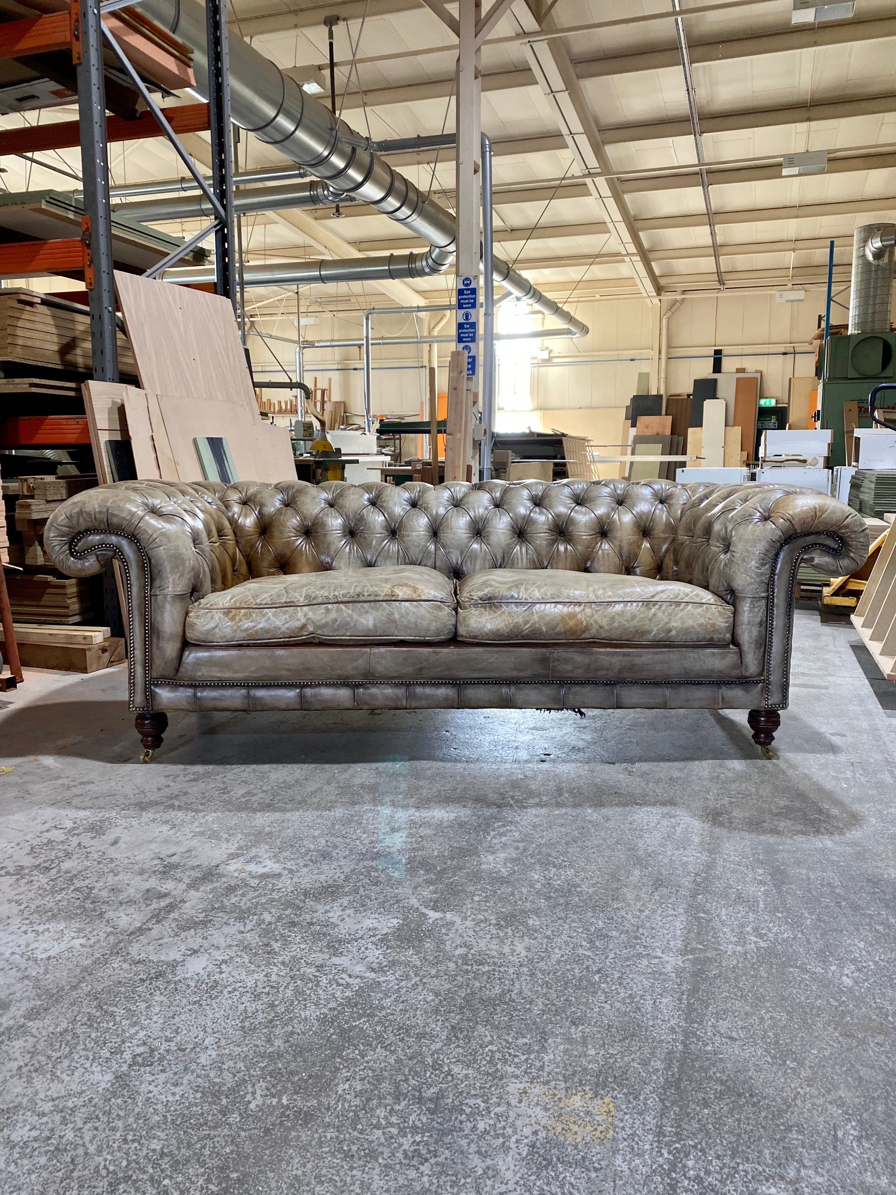 A very Smart 20thC Chesterfield Sofa in very Well Patinated Hand Dyed Leathers