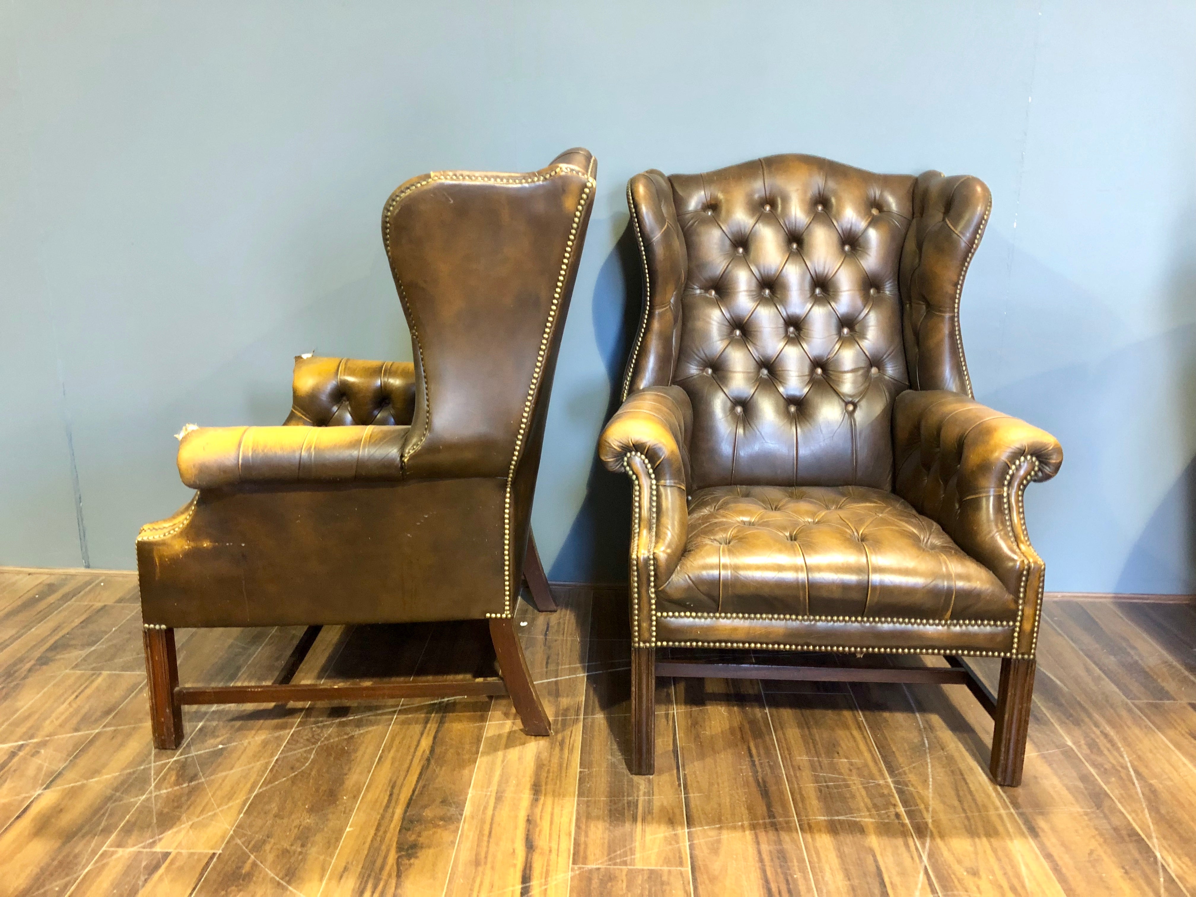 A Super Matching Pair of Vintage Leather Chesterfield Wing Back Chairs