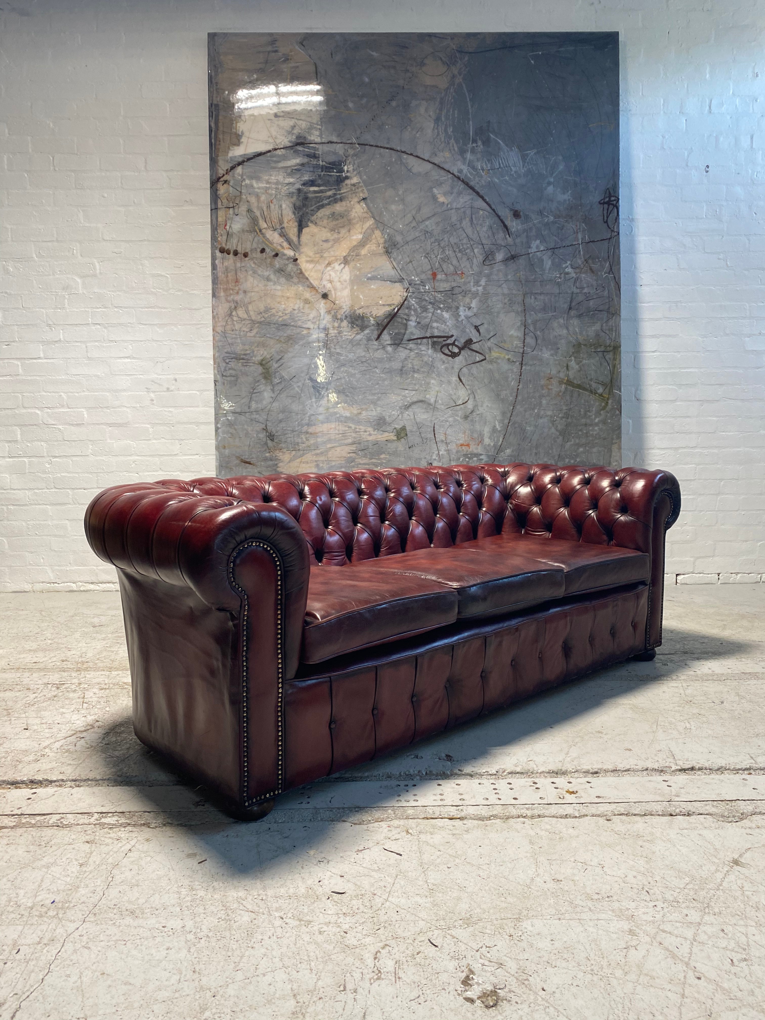 An Incredibly Rich Hand Dyed Vintage MidC Chesterfield Sofa