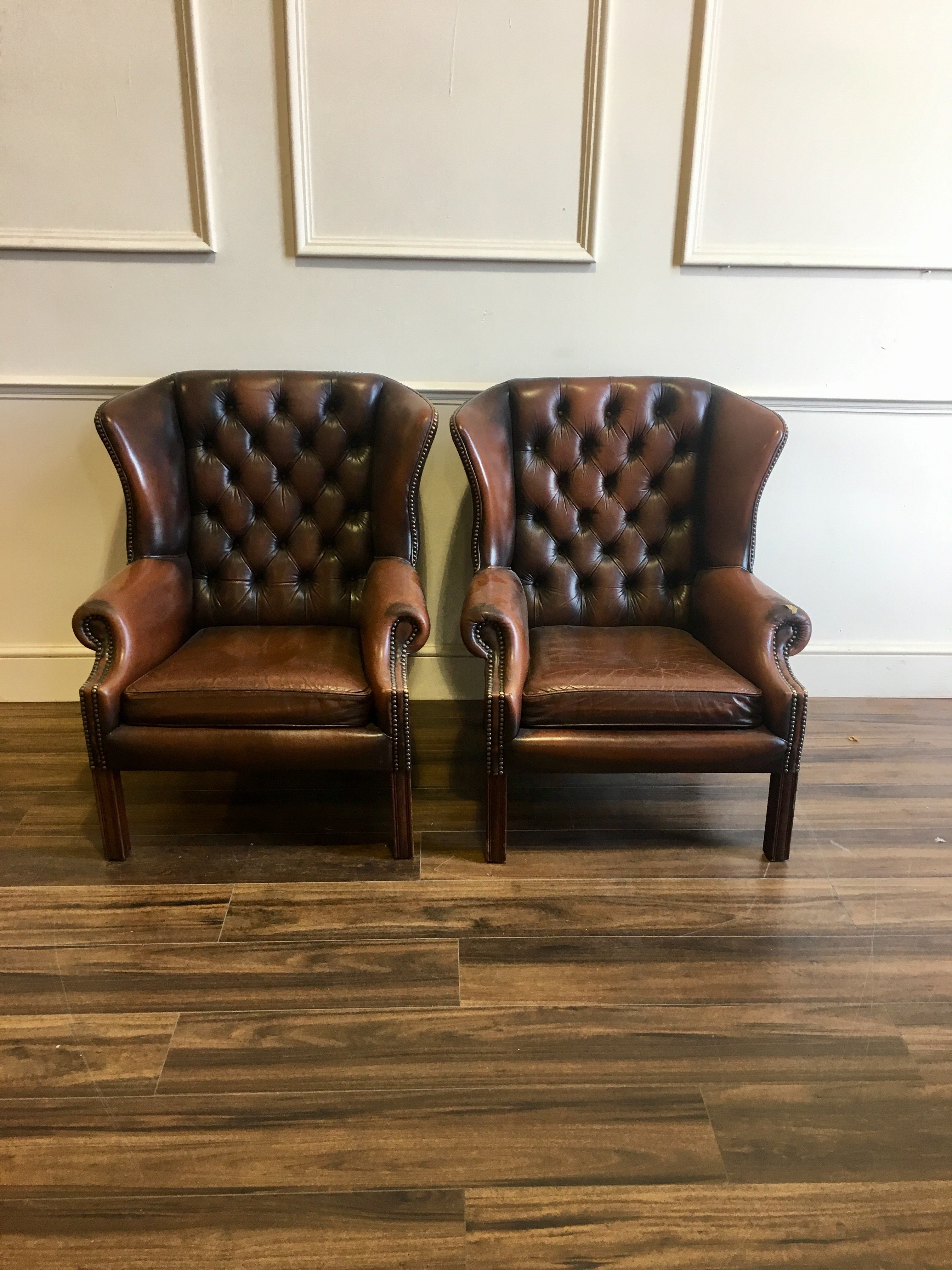 A Super Matching Pair of Leather Chesterfield Wing Back Chairs