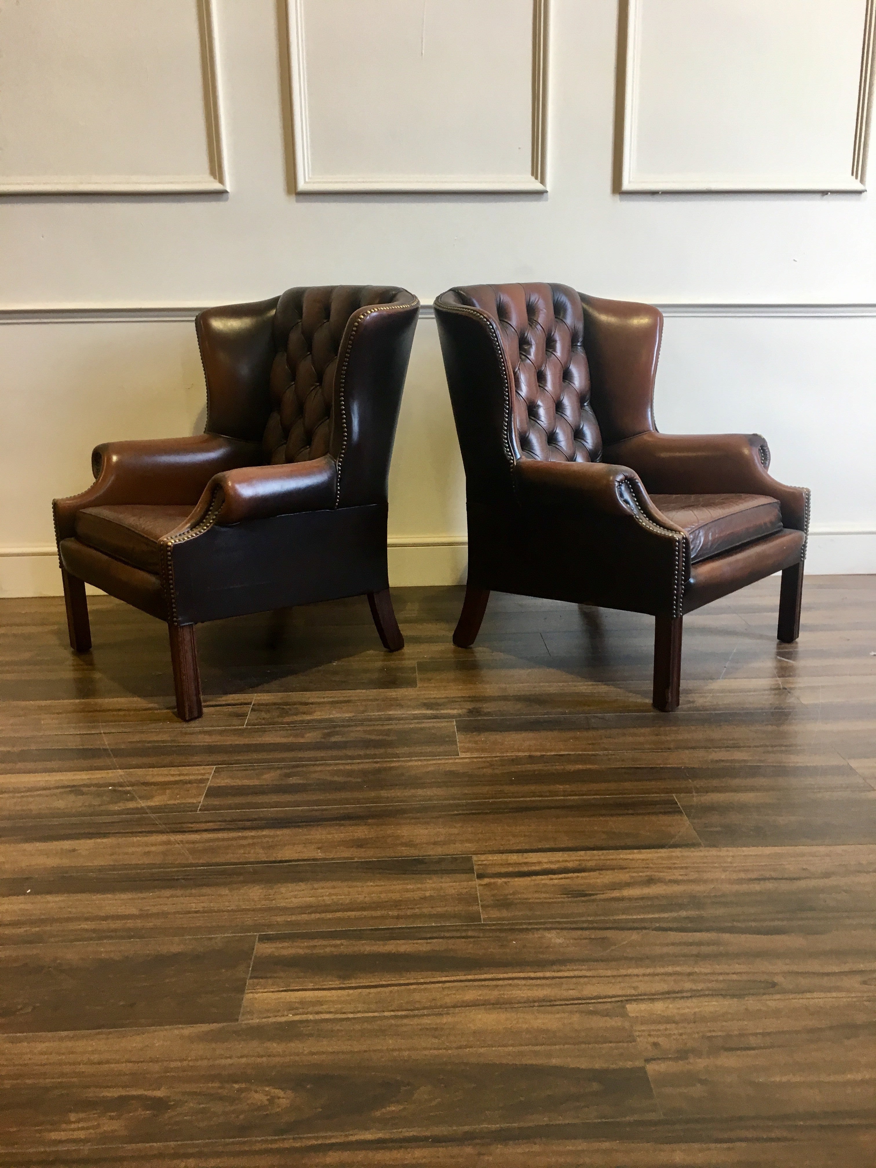 A Super Matching Pair of Leather Chesterfield Wing Back Chairs