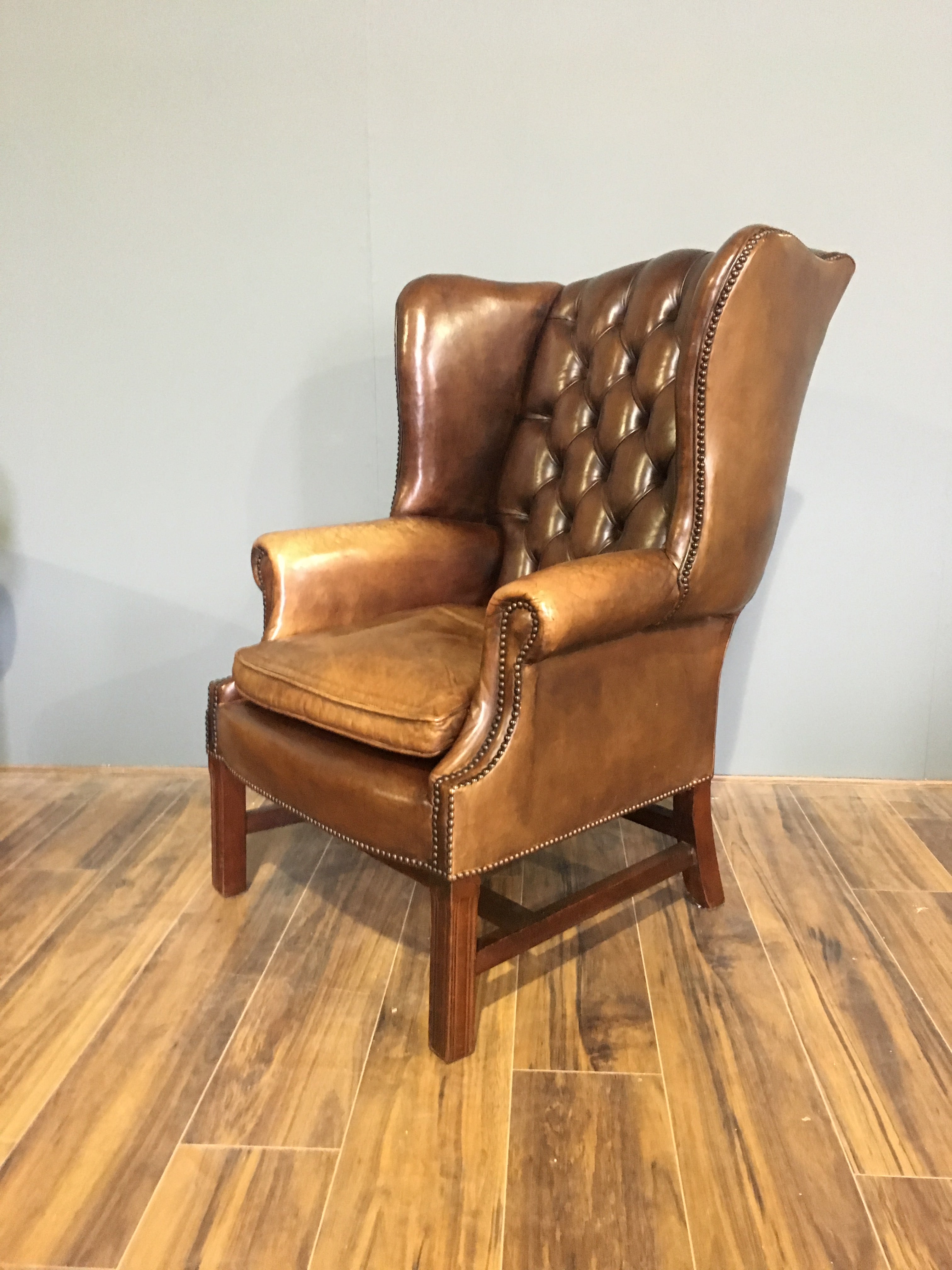 An Exceptional Vintage Leather Chesterfield Wing Chair