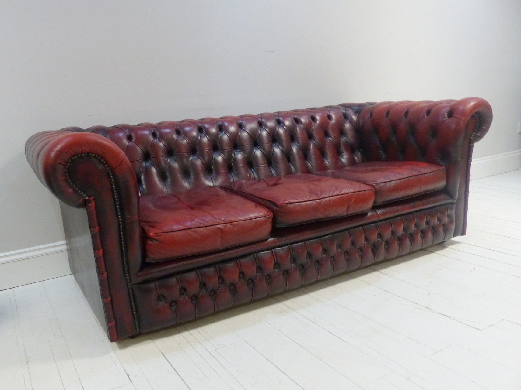 THREE SEAT OXBLOOD SOFA