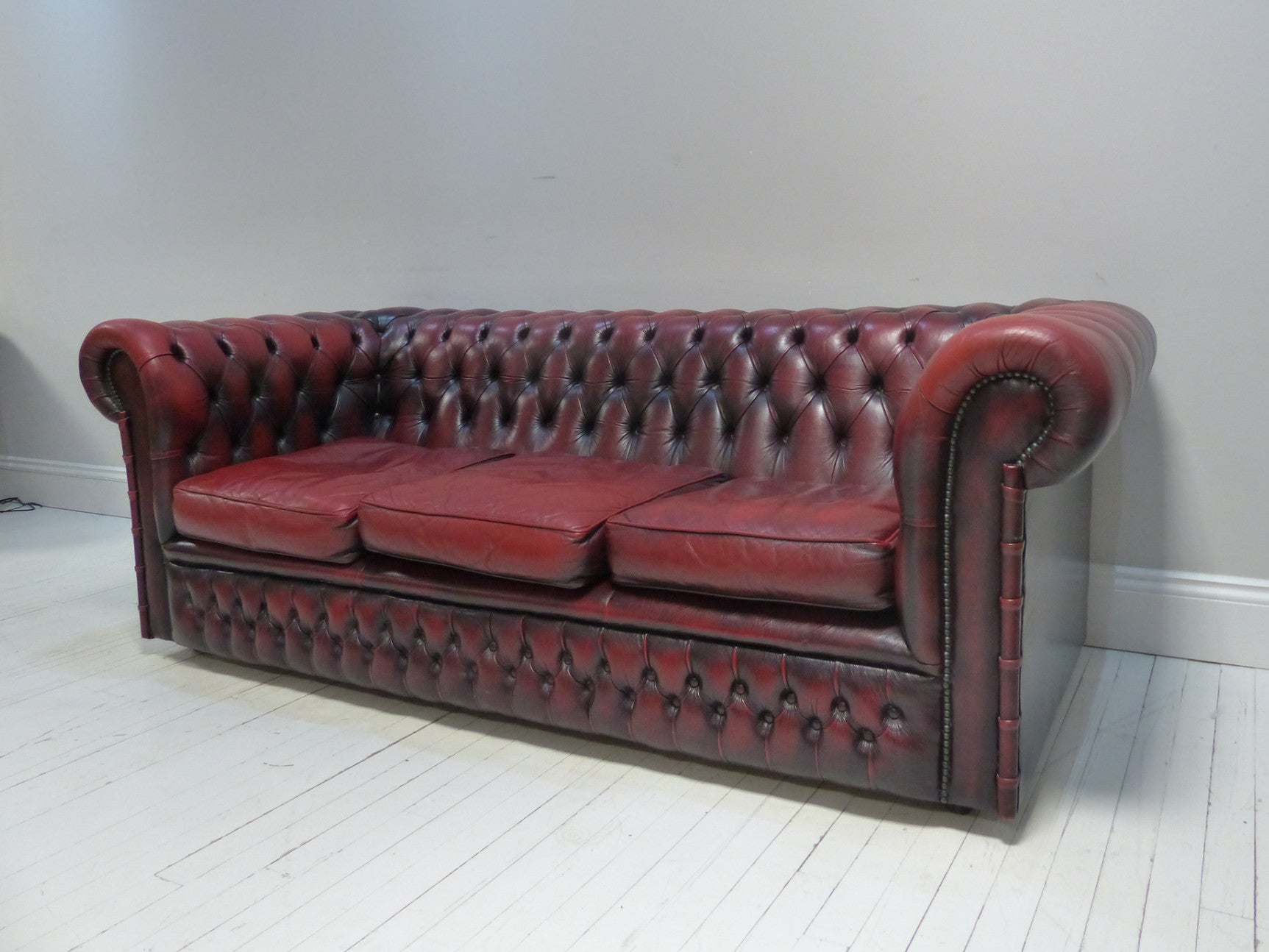 THREE SEAT OXBLOOD SOFA