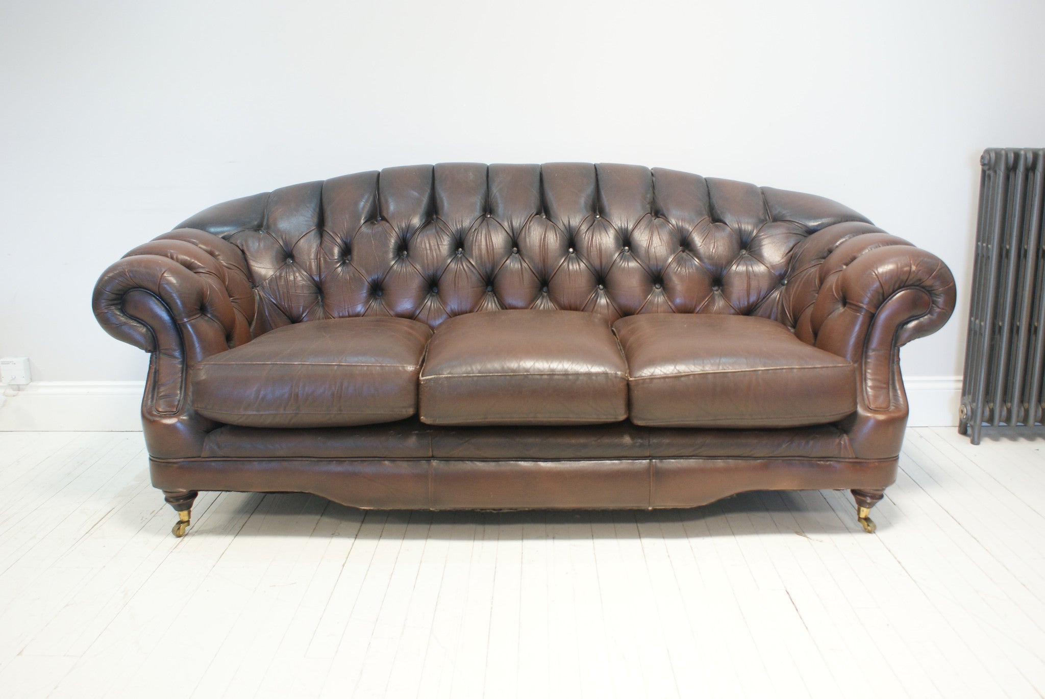 A VERY NICE PRELOVED CHESTERFIELD WITH HIGH BACK